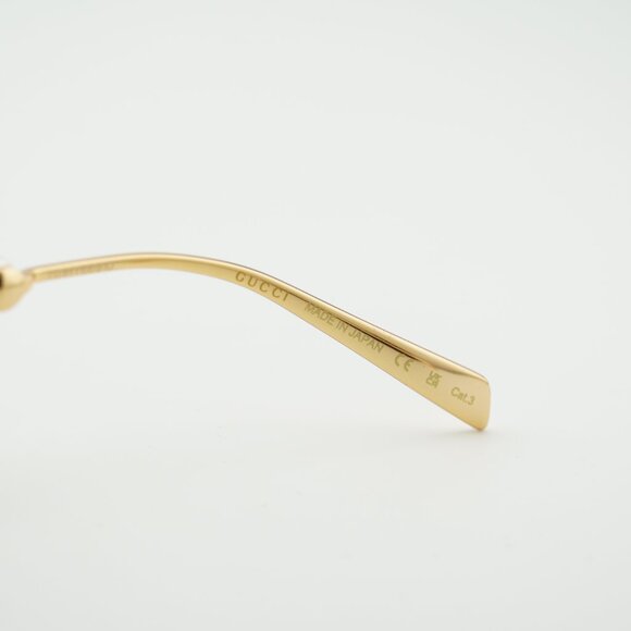 Gucci GG1922S 001 Sunglasses Gold with White Pearl Oval Frame, Grey Lenses